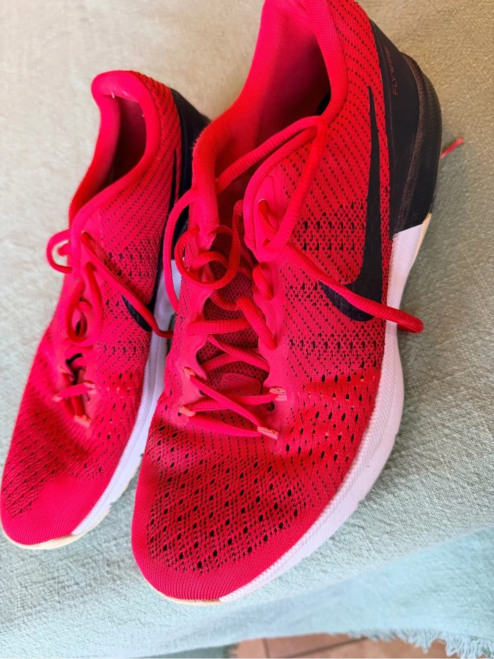 Nike Men’s Red and Black Flyknit Athletic Shoes